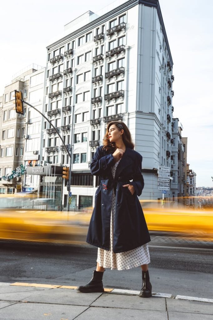 Woman Standing on Sidewalk